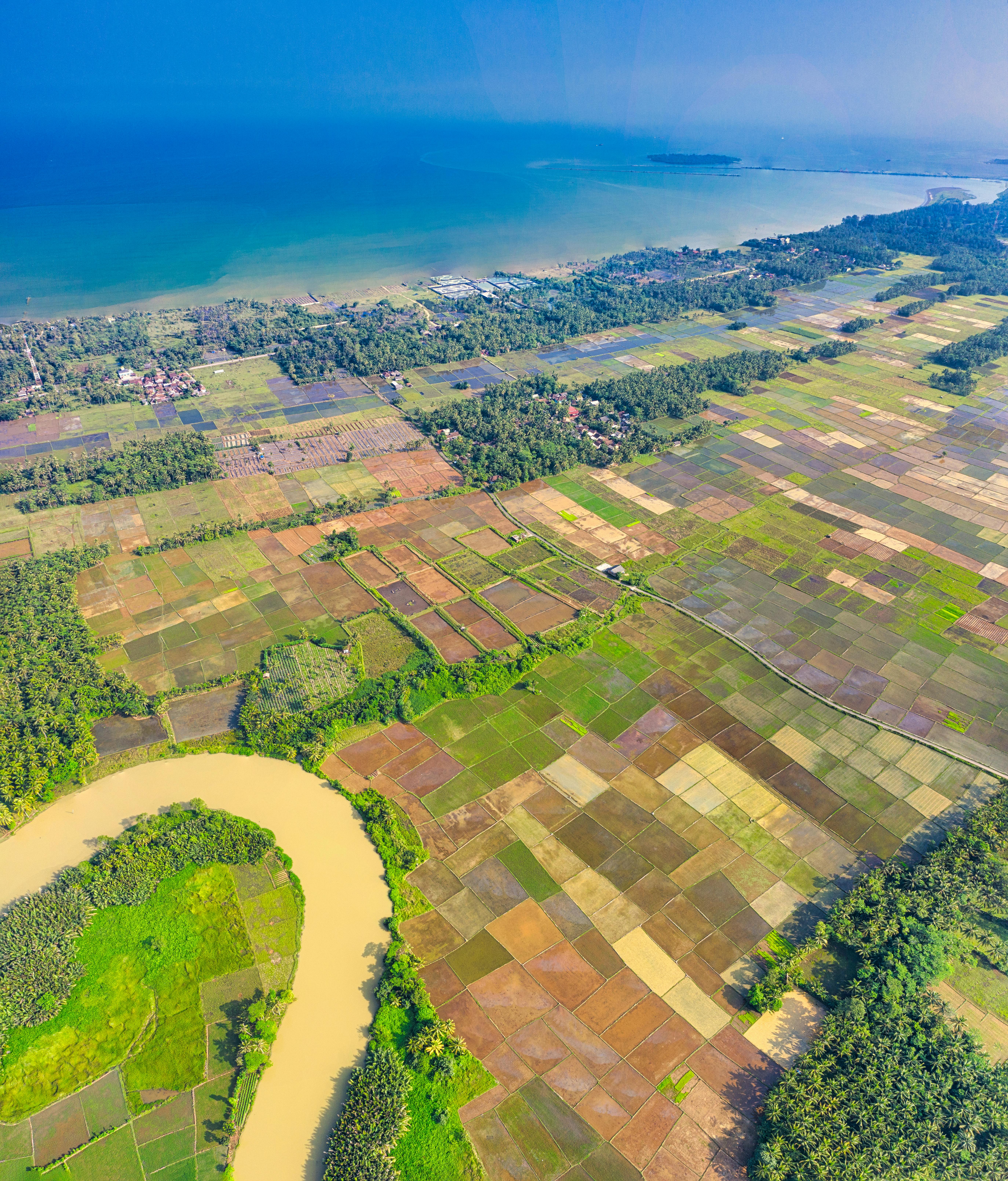 Aerial Photo of Land Near Sea · Free Stock Photo