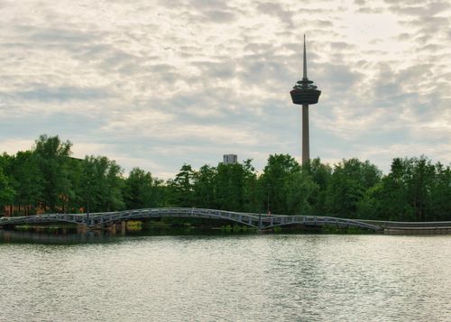 Free Discover the iconic Colonius Tower in Cologne, Germany set against a picturesque riverside landscape. Stock Photo