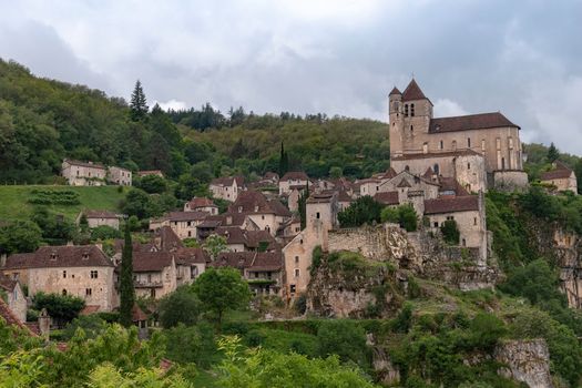 Explore the stunning medieval architecture in Saint-Cirq-Lapopie, a charming village in France's Occitanie region.