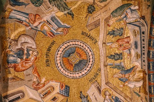 Intricate Byzantine mosaic depicting religious figures and themes with gold and vivid colors.