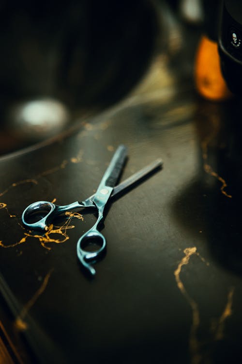 A pair of scissors on a counter