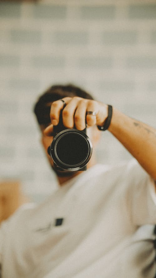 A man taking a photo with his camera