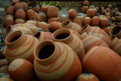 Free A collection of handmade clay pots in an outdoor setting, showcasing artisanal crafting skills. Stock Photo