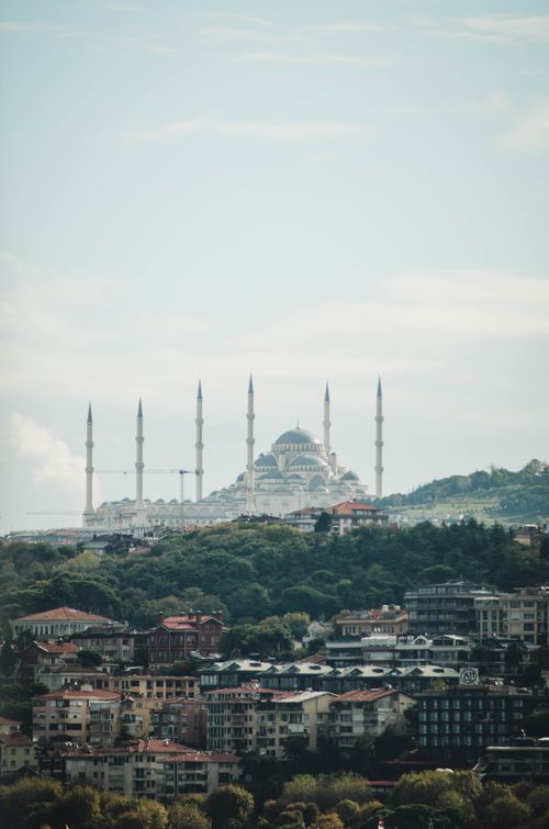 Free The Istanbul skyline with the prominent mosque minarets and a dome visible against a cloudy sky. Stock Photo