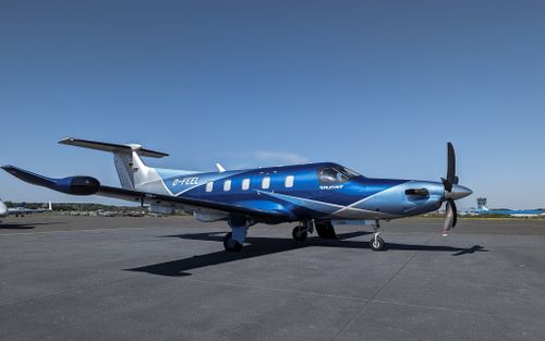 Free Sleek blue private plane parked on the runway at Sylt Airport under a clear sky. Stock Photo