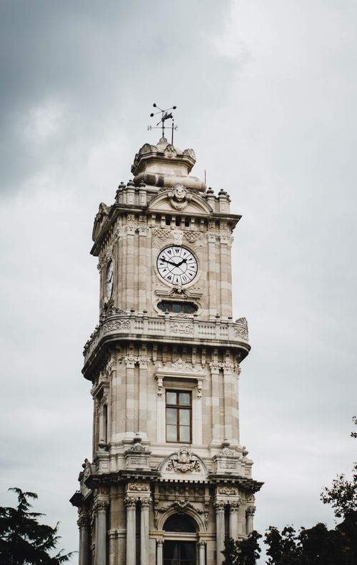 Free Stunning view of the Dolmabahçe Clock Tower against a cloudy Istanbul sky. Stock Photo