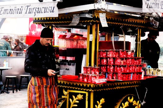A vendor selling traditional pickled vegetables at an outdoor stand in Istanbul's street market.