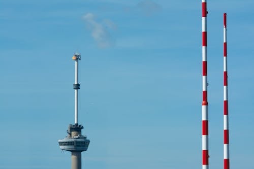 Two tall towers with red and white stripes