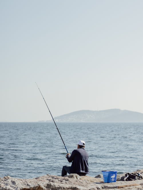 açık hava, adam, balık içeren Ücretsiz stok fotoğraf