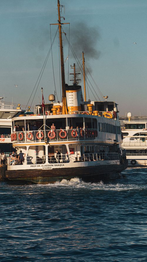 Free A passenger ferry carrying people across a city's waters, capturing urban maritime travel. Stock Photo