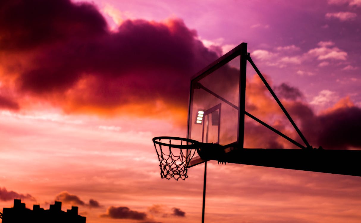 Free Silhouette Photo of Basketball Hoop During Golden Hour Stock Photo