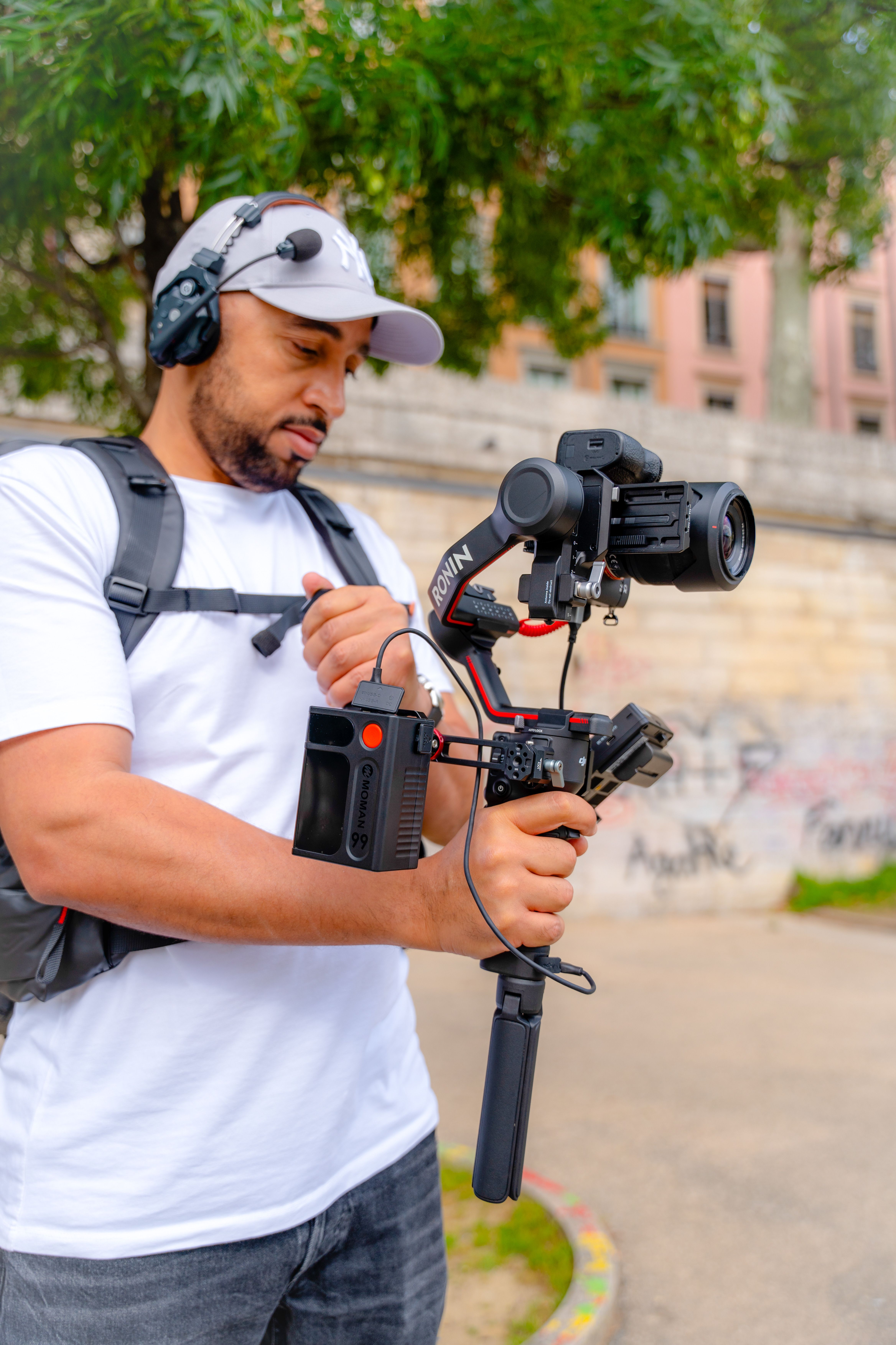 Man Using a Modern Camera with a Stabilizer · Free Stock Photo