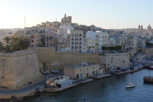 Free A stunning aerial view capturing Valletta's historic architecture and coastal skyline at dusk. Stock Photo