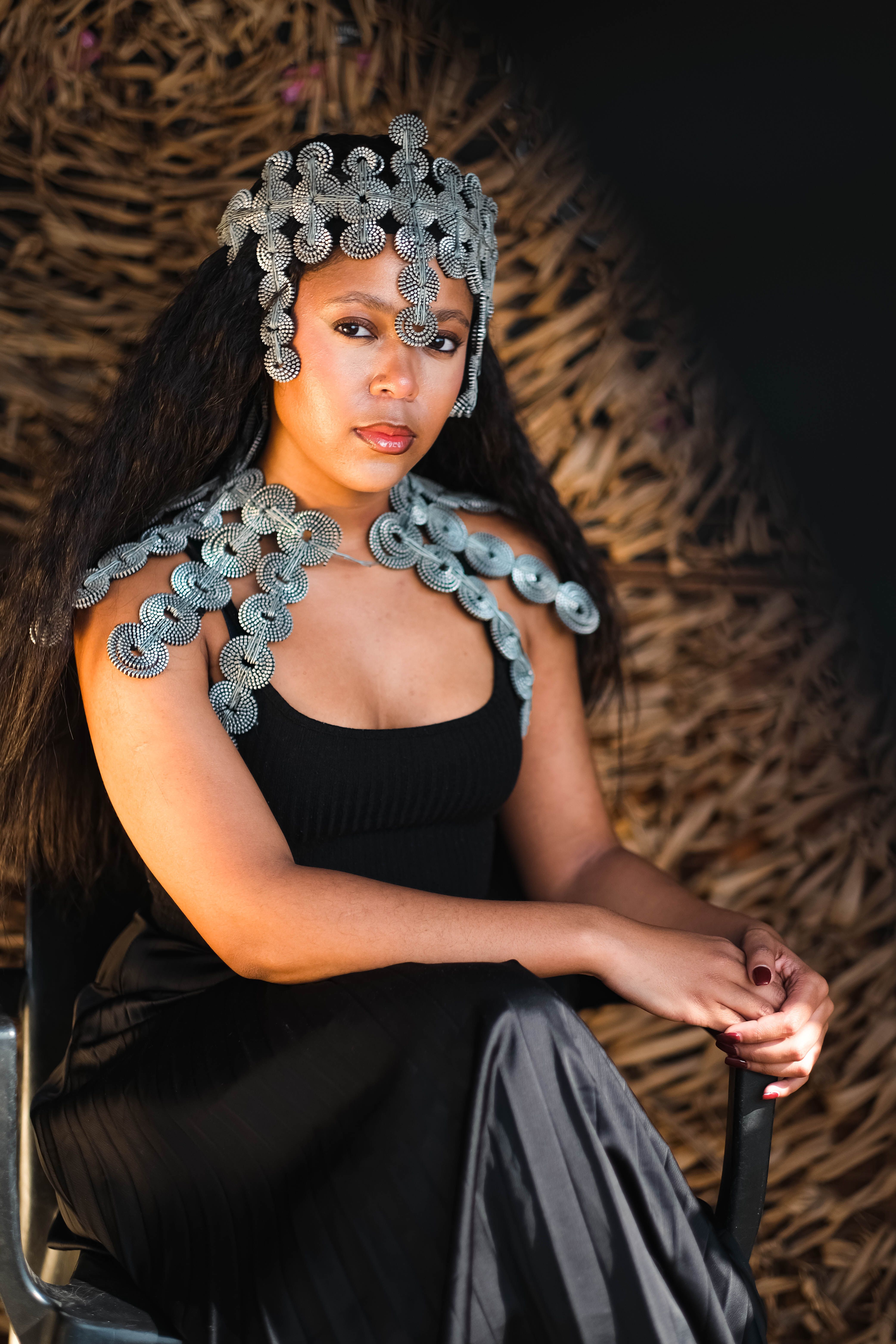 Photo of a Woman in a Black Dress Wearing a Silver Head Jewelry  Free  Stock Photo