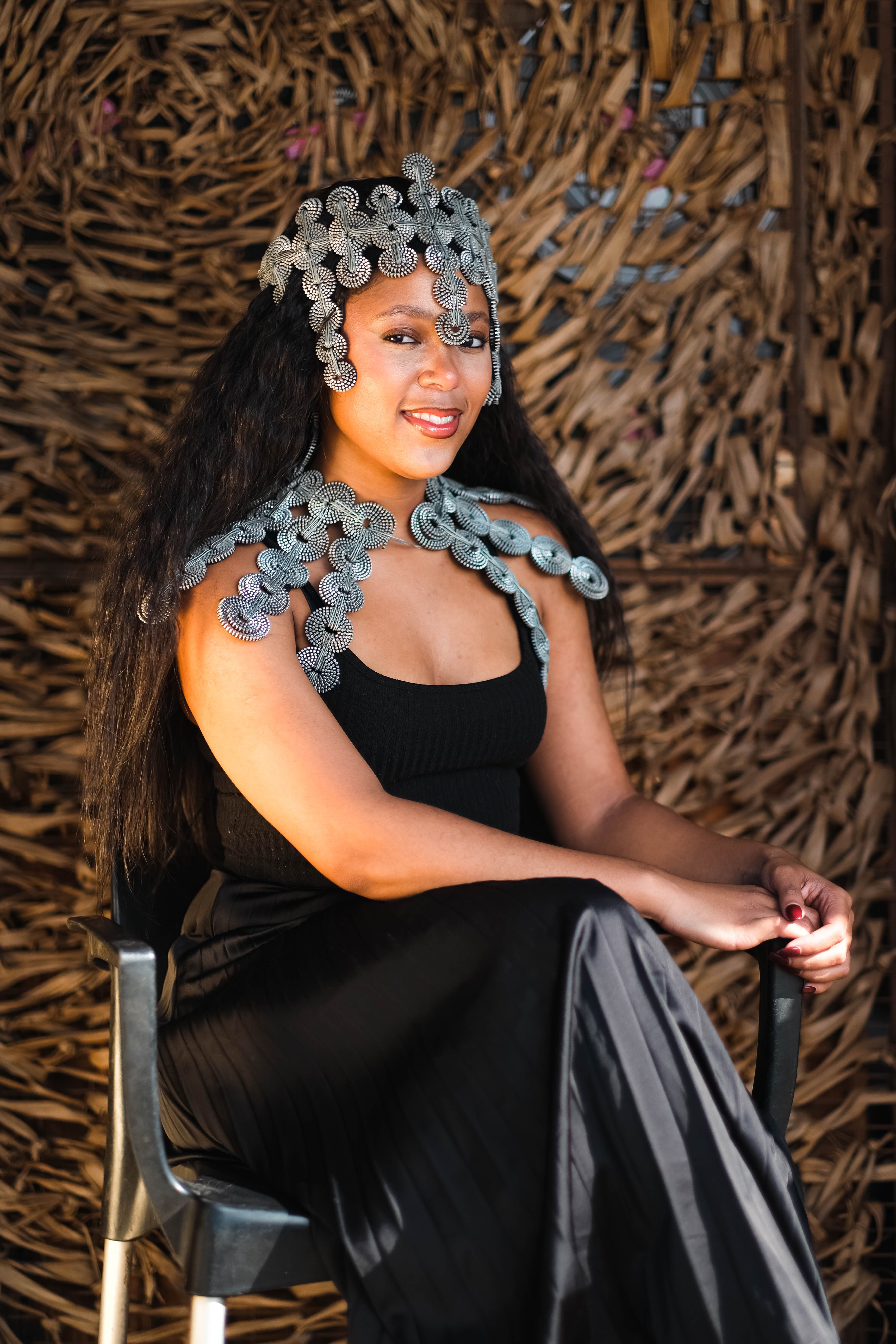 Photo of a Woman in a Black Dress Wearing a Silver Head Jewelry  Free  Stock Photo