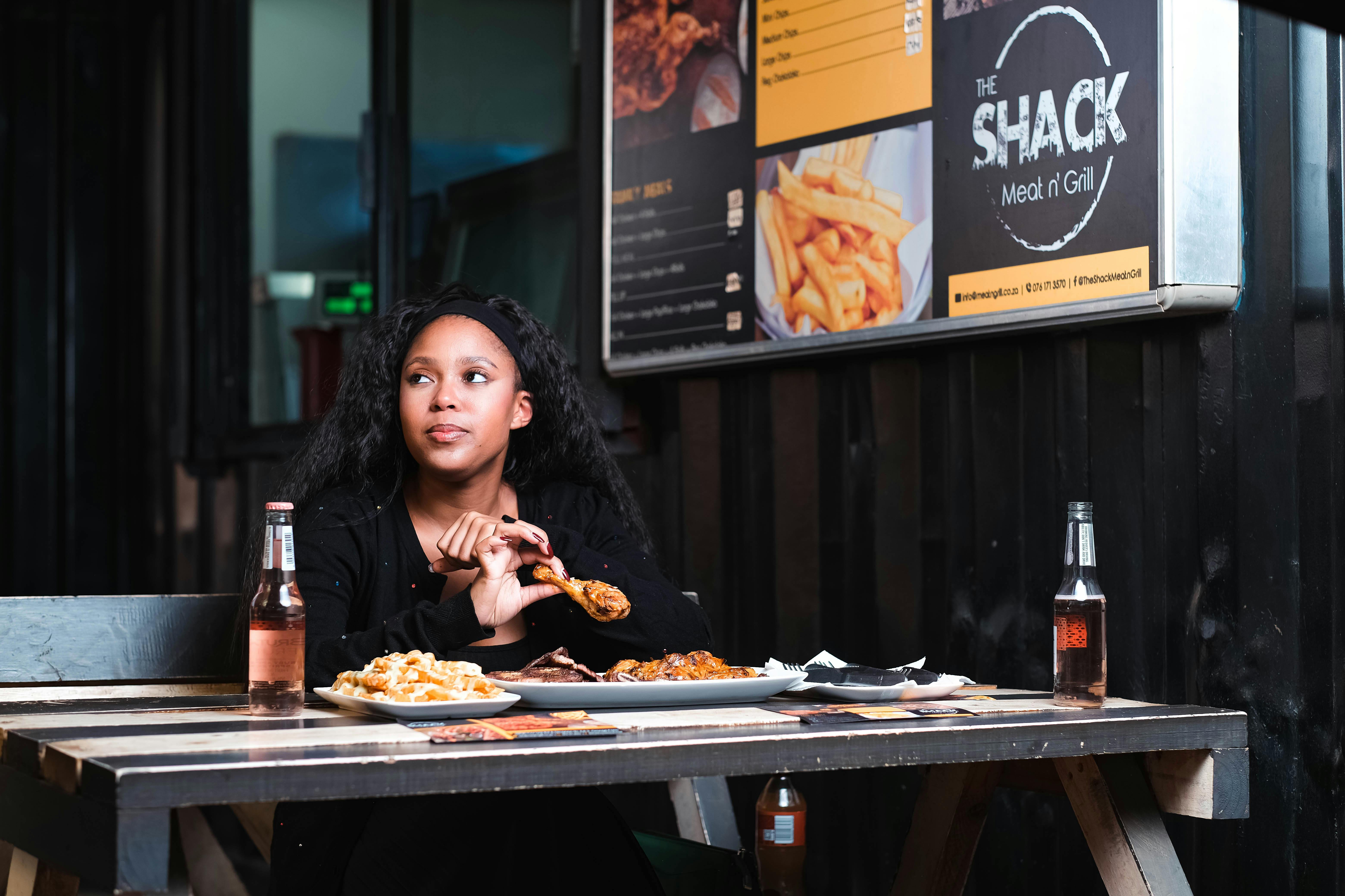 Woman looking at empty plate while fasting, intermittent fasting for women over 40