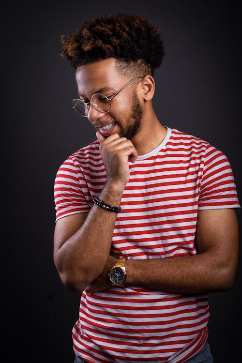 Photo of a Man wearing a White and Red striped Crew-neck T-shirt