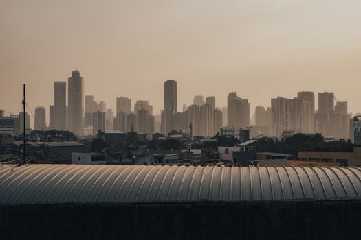 Elevated view of Jakarta's skyline with iconic skyscrapers at dusk, showcasing urban architecture.