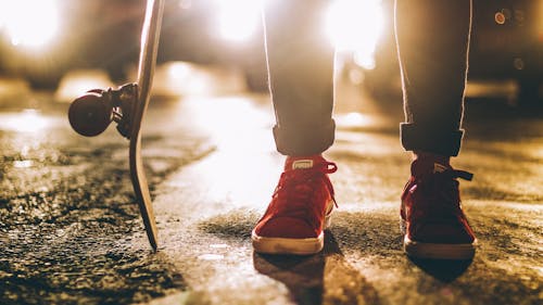 Photo of Person Wearing Red Sneakers