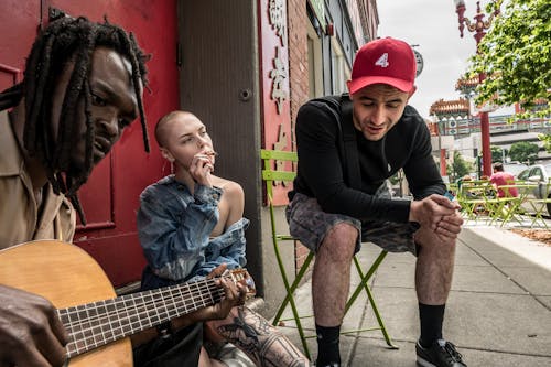 Three Person Sitting Outdoor