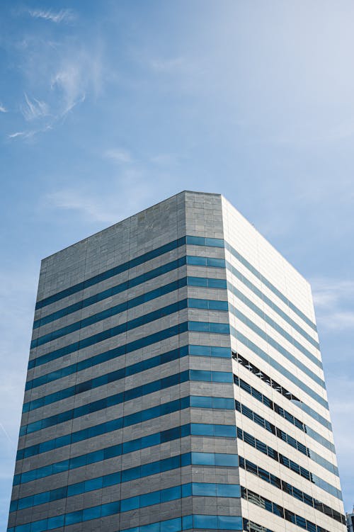 Grey High-rise Building Under Blue Sky