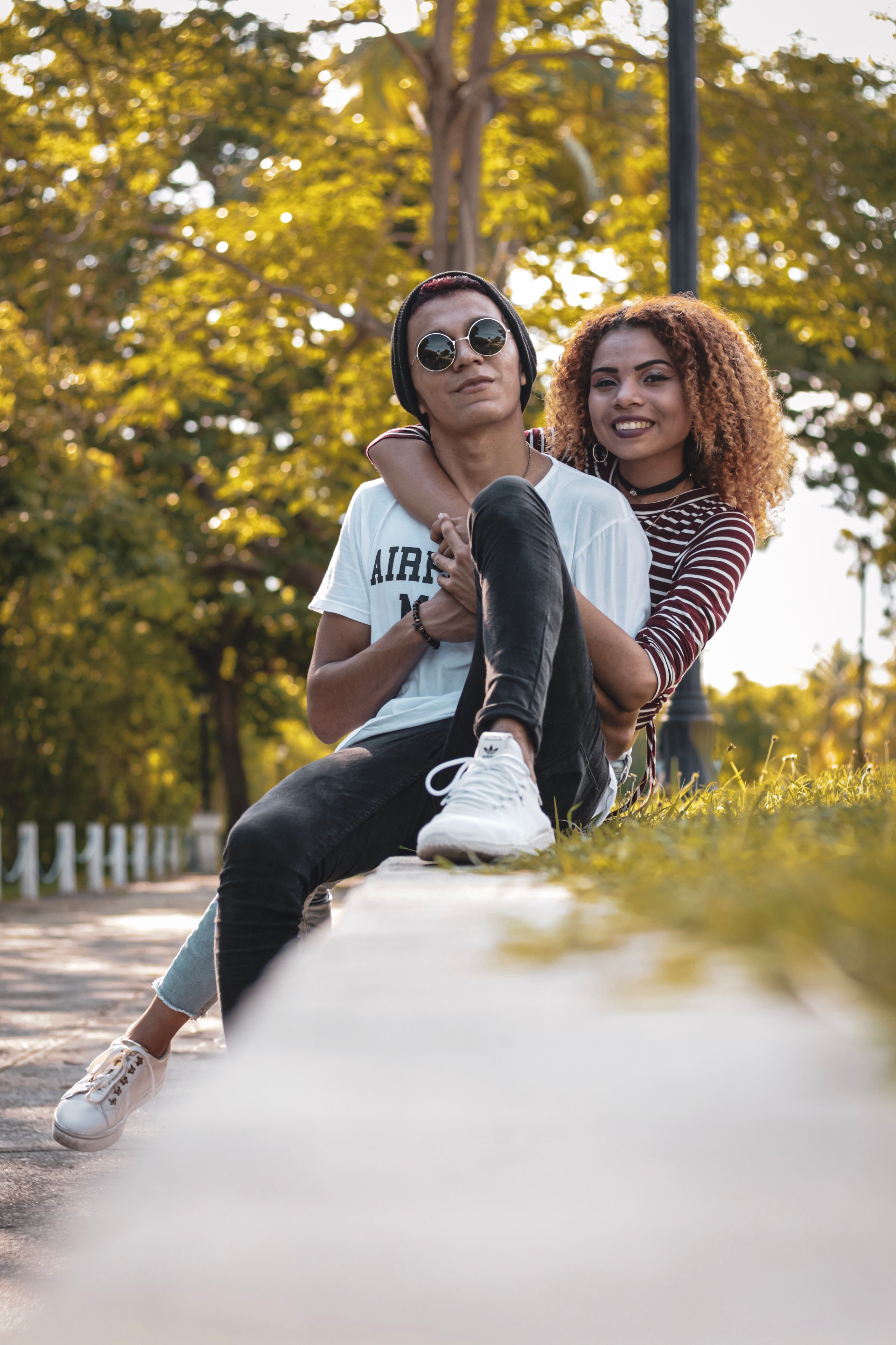 Photo of a woman hugging man from behind him · Free Stock Photo