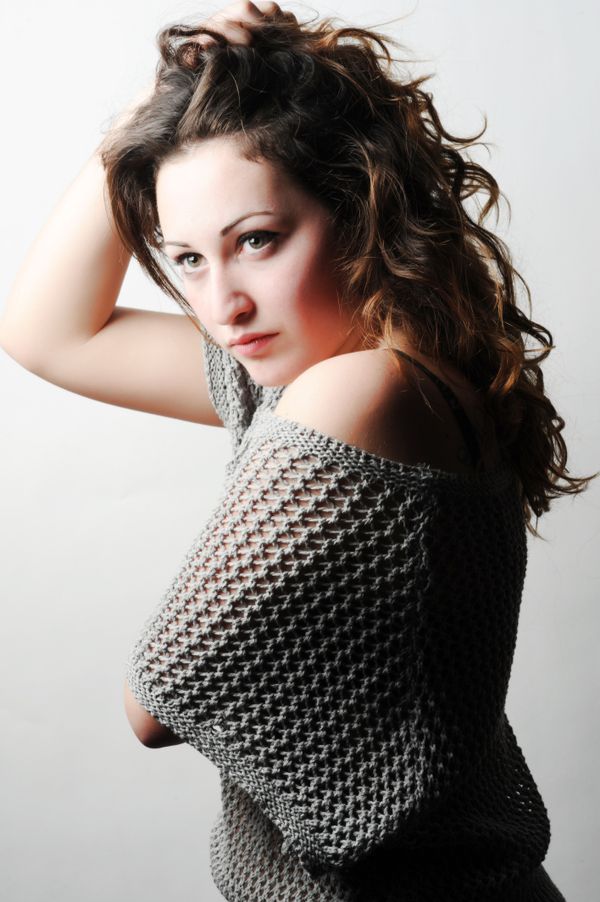 Model in a metallic knit halter top, photo by Andrea Musto on Pexels