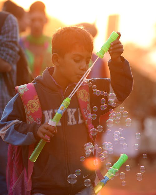 Boy Blowing Bubbles