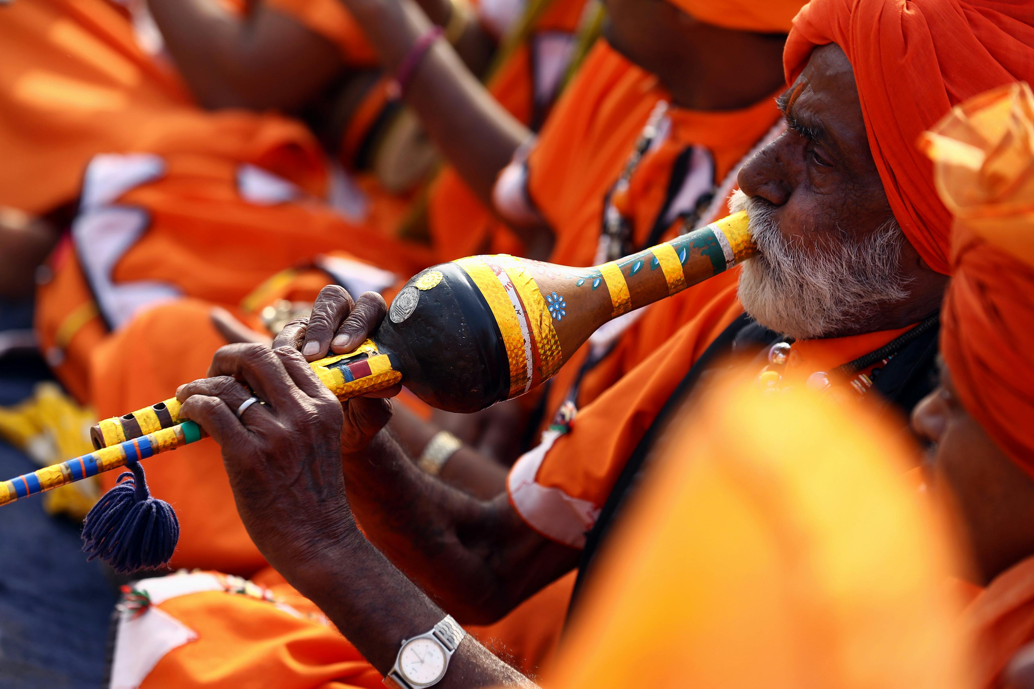 Close-Up Photo of Man Playing Wind Instrument
