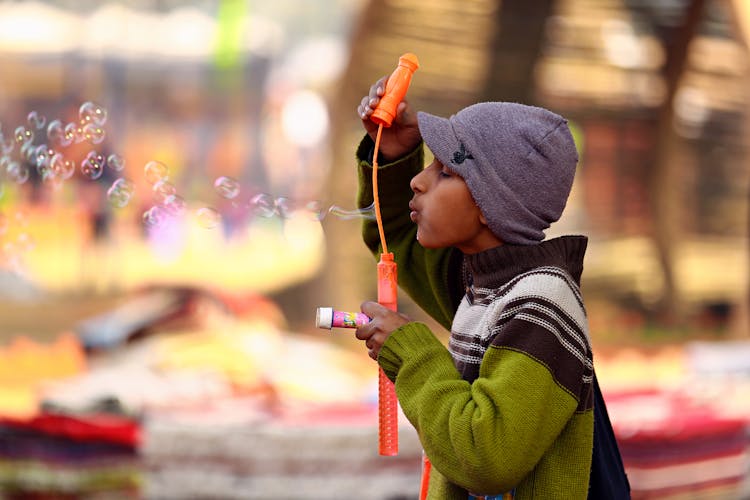 Photo Of Boy Blowing Bubbles