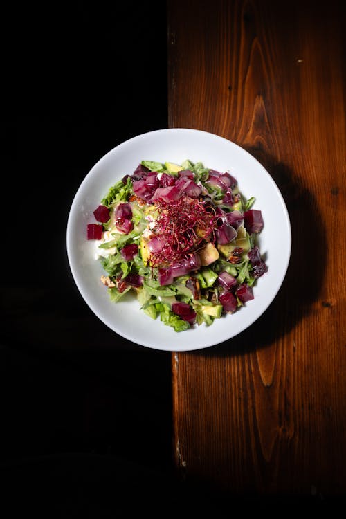 A salad with beets and other vegetables on a plate