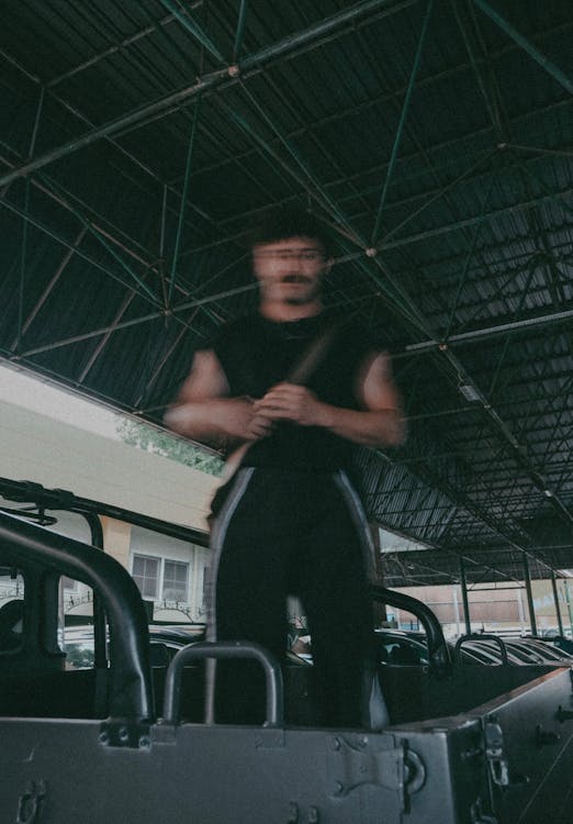 A man standing on top of a truck