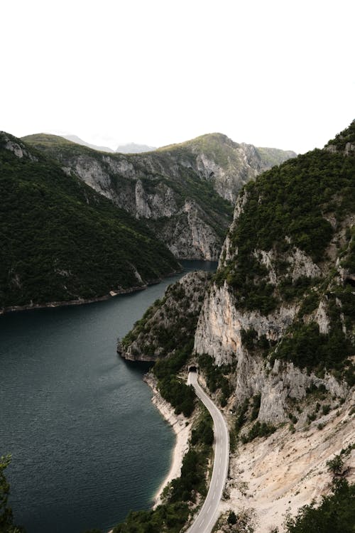 A scenic view of a road and a lake