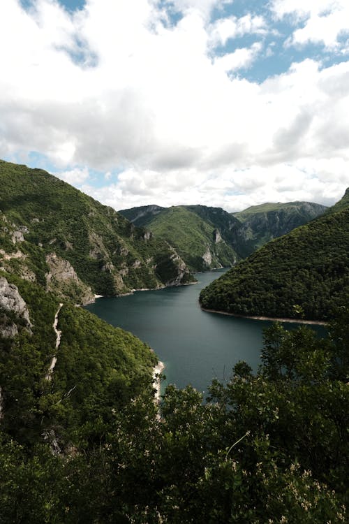 A view of a lake surrounded by mountains