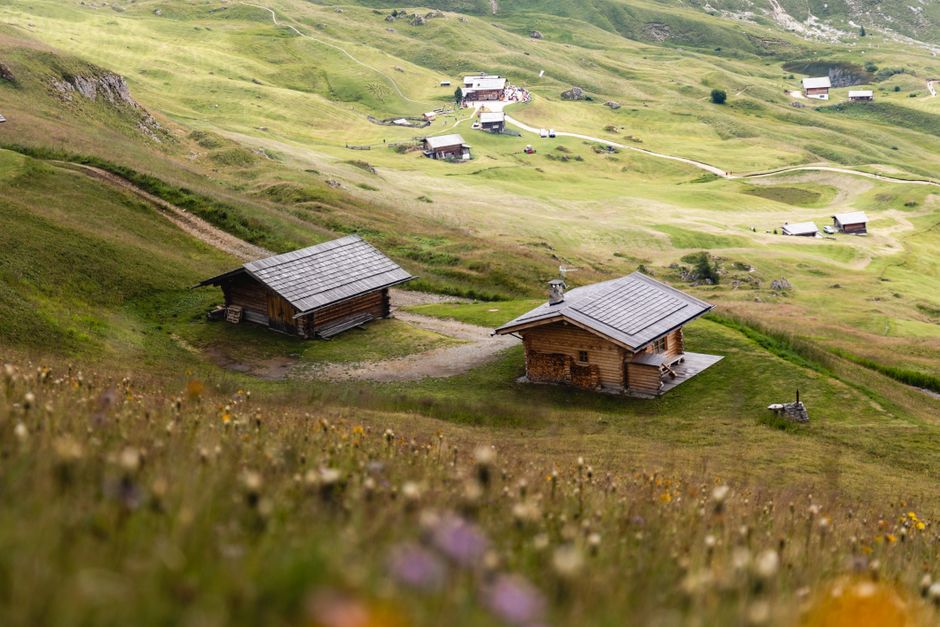 Charming wooden cottages nestled in a picturesque rural mountain village.