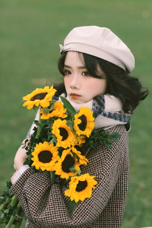 A girl with sunflowers in her hands