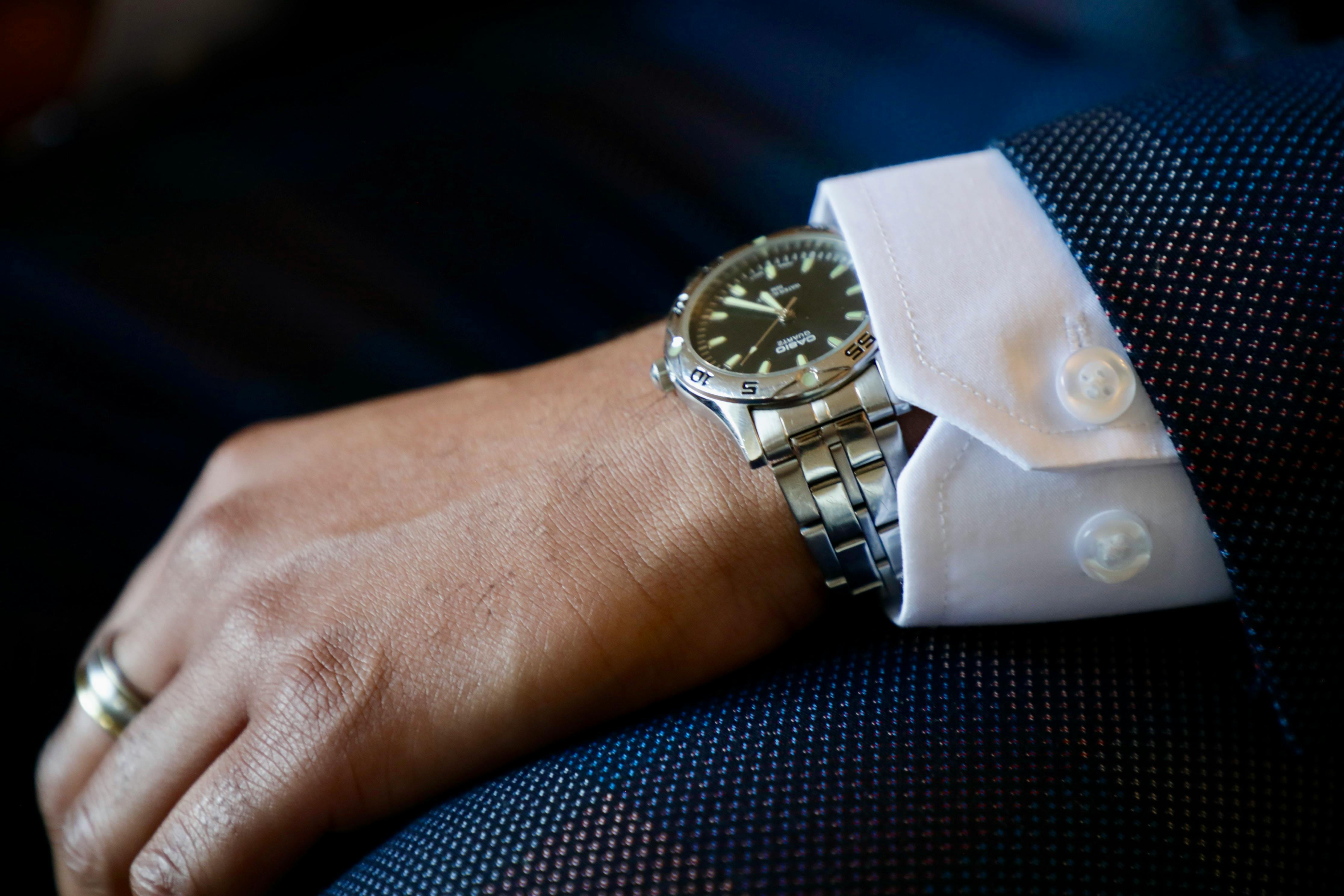 Arm of Businessman in Formal Suit with Silver Casio Watch · Free Stock ...