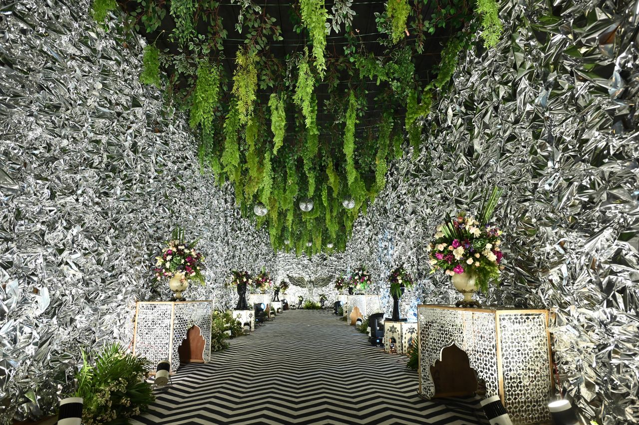 a lavishly decorated wedding venue in jaipur india featuring silver wa