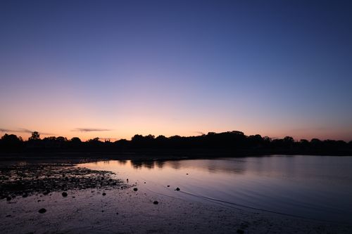 Free Serene twilight over a lake in Stamford, Connecticut with a calm horizon. Stock Photo