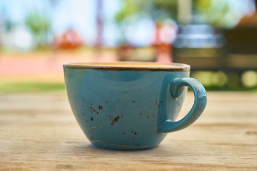 Close-Up Photo of Teal Ceramic Cup