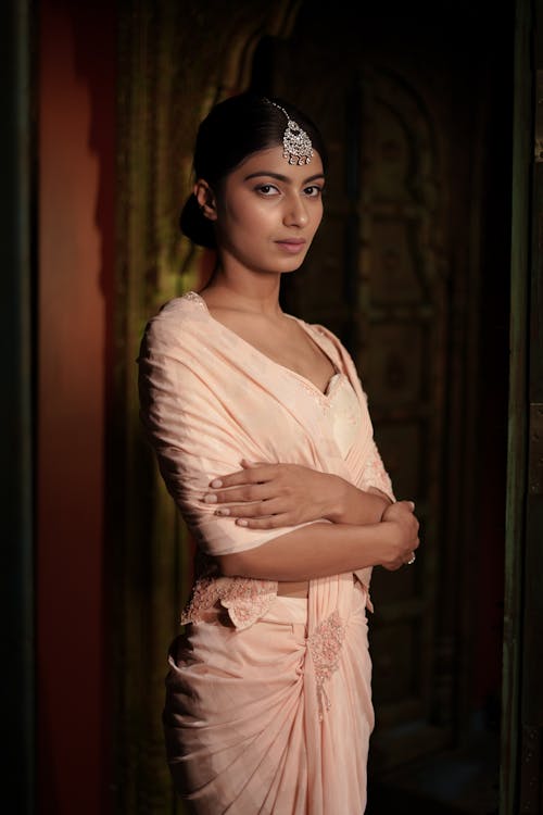 A beautiful woman in a pink sari