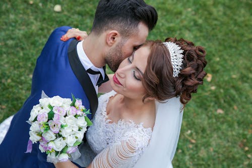 Free Happy Couple Holding Flower Stock Photo