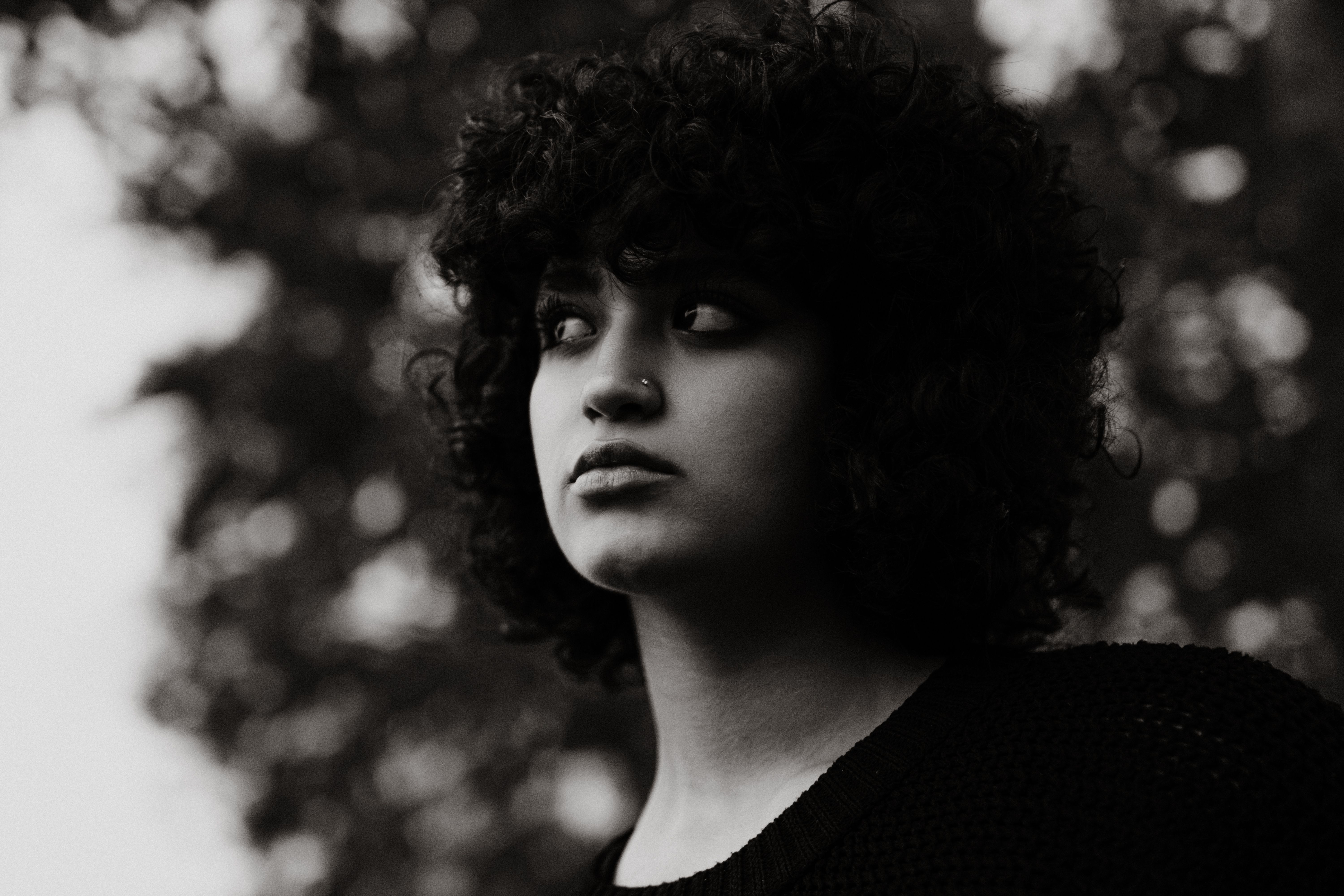 Black and White Photography of a Woman in Curly Hair · Free Stock Photo