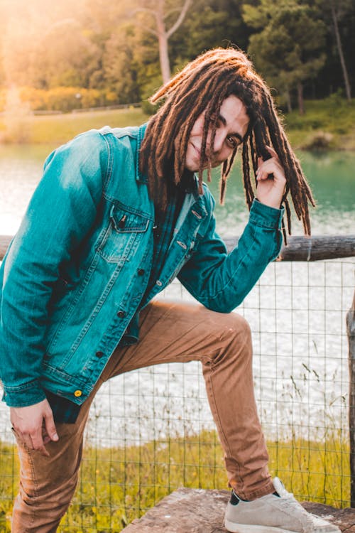 Man In Denim Jacket And Brown Pants