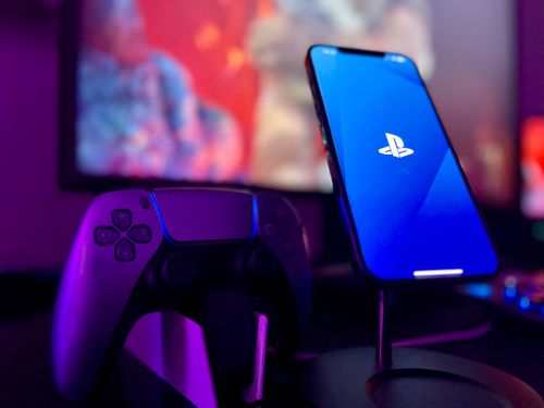 Free PlayStation DualSense and Apple iPhone  Stock Photo
