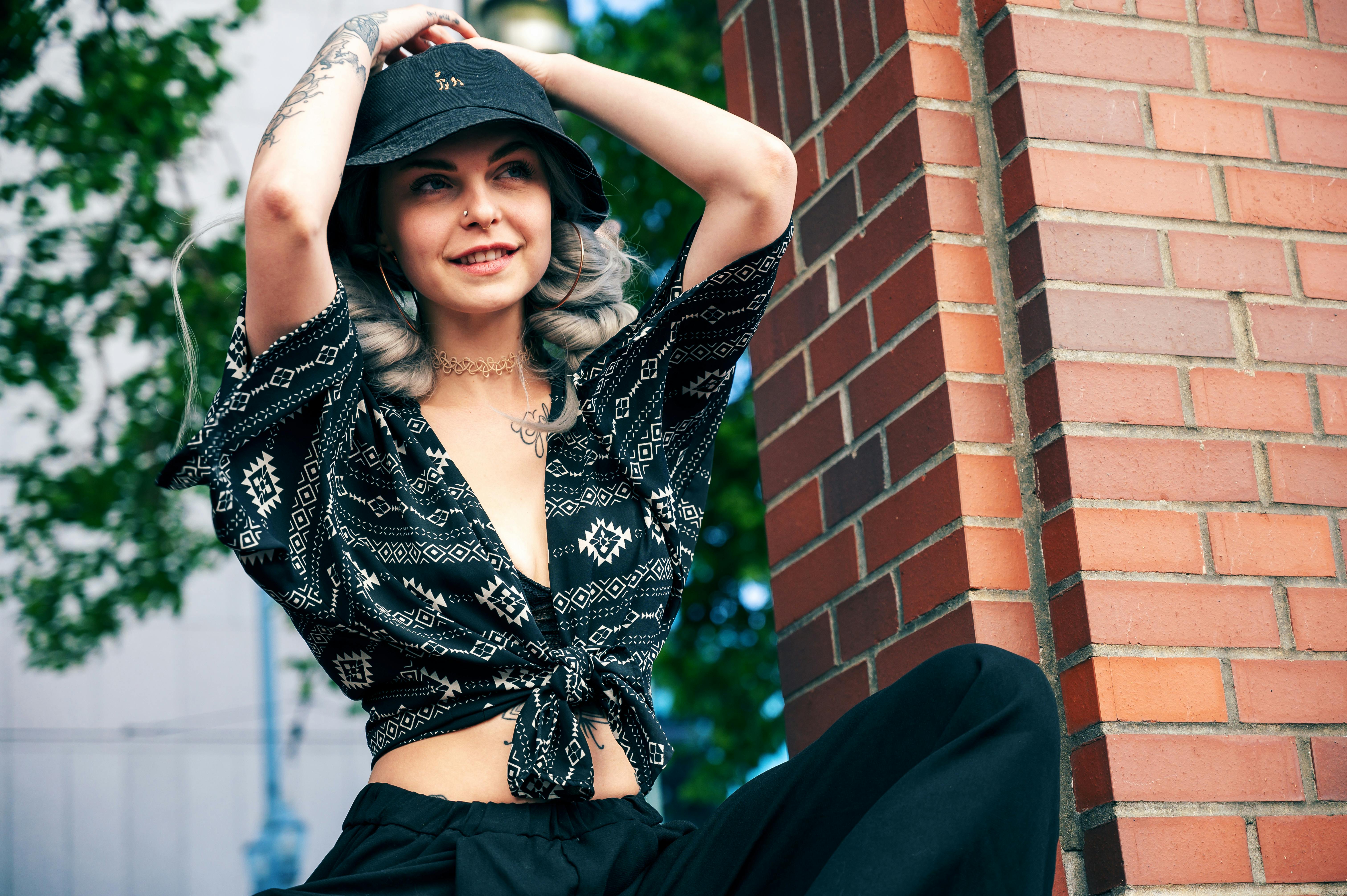 Fashionable woman poses outdoors in trendy outfit. Perfect for lifestyle stock photos.