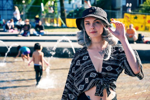 Free Woman Standing Near Water Fountain Stock Photo