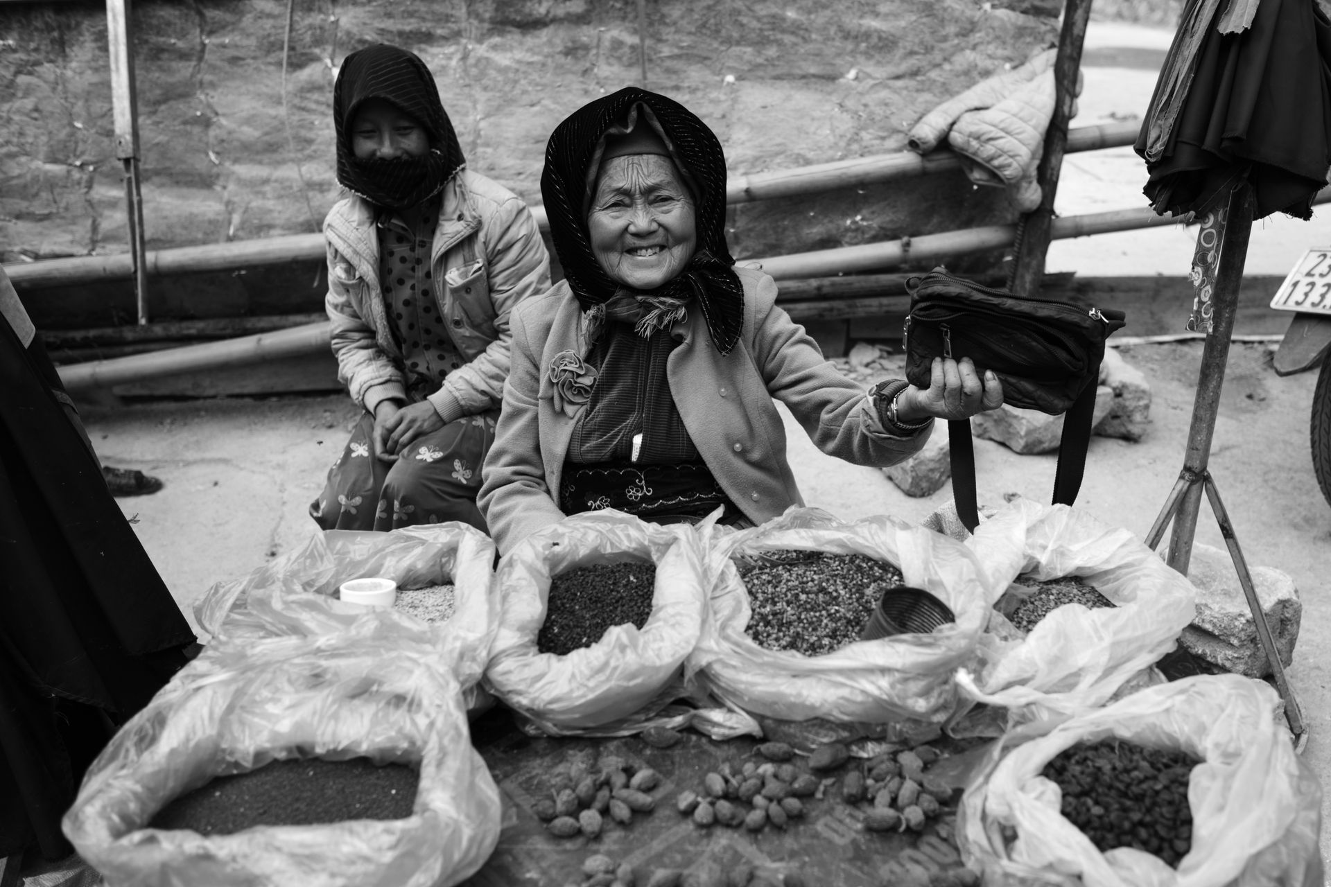 Smiling Sellers Sitting at Bazaar