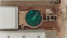 Aerial View of Industrial Facility with Circular Tank