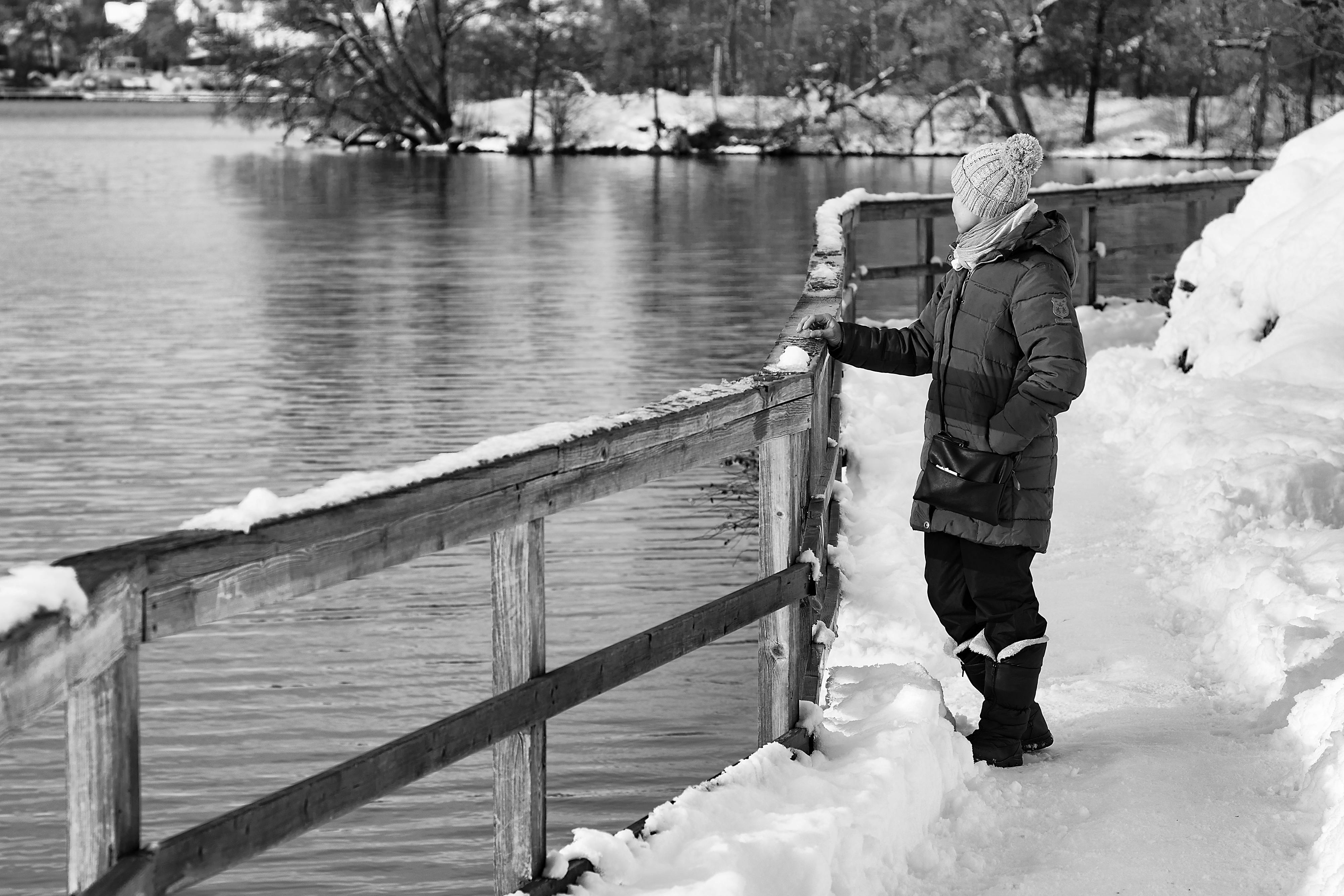 man standing on riverbank